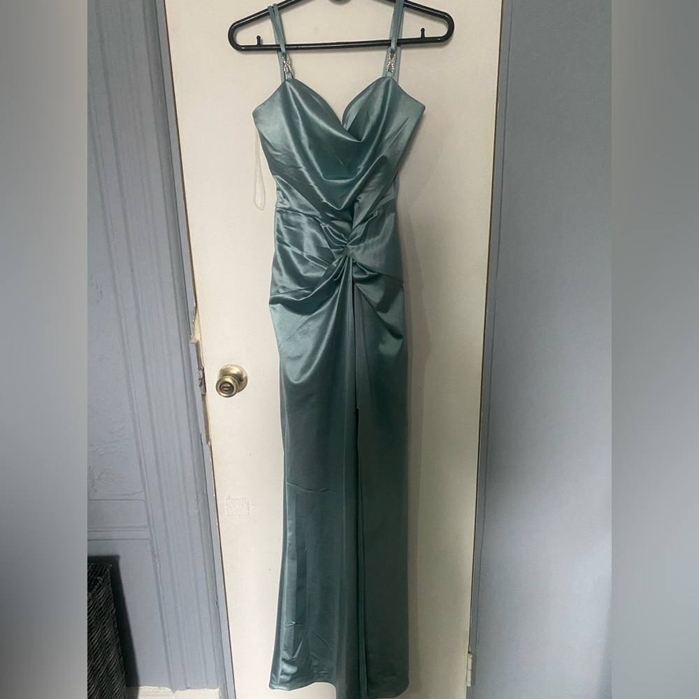 selling a beautiful light teal dress with bling strap details in a size small